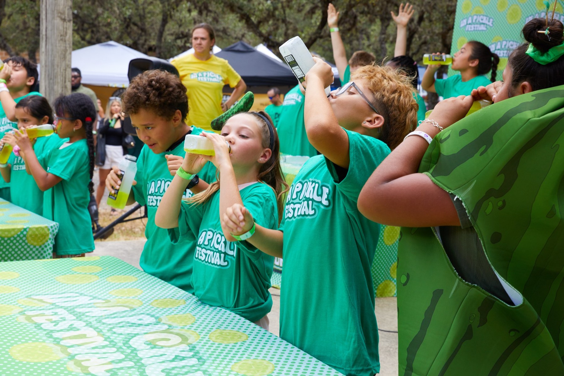 Kids competing in the pickle juice contest