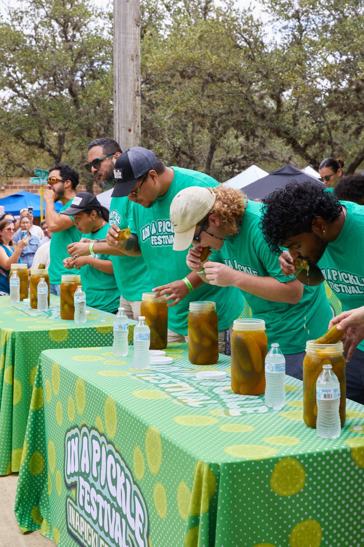 Children competing in pickle eating