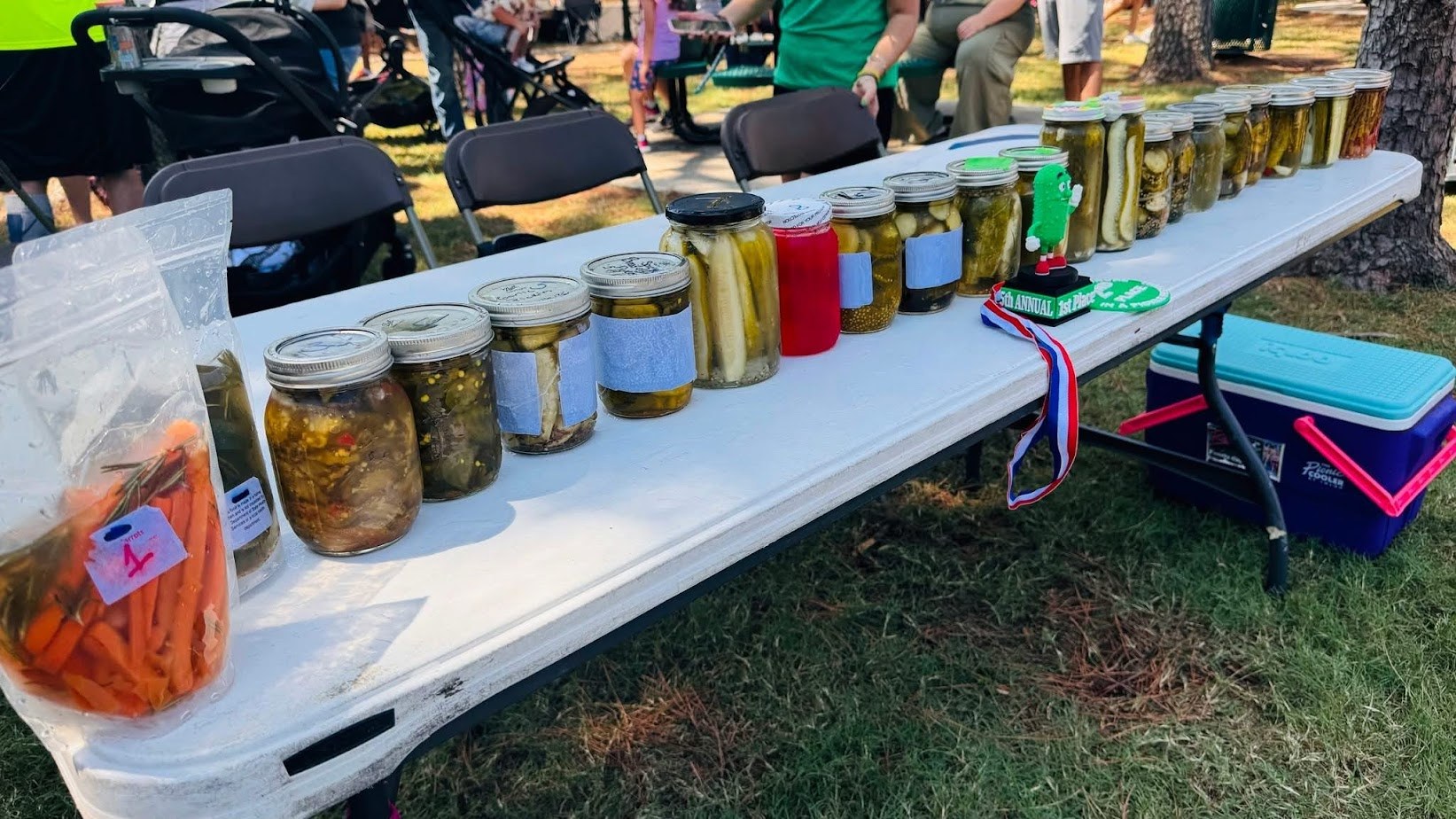Homemade pickle varieties on a vendor table