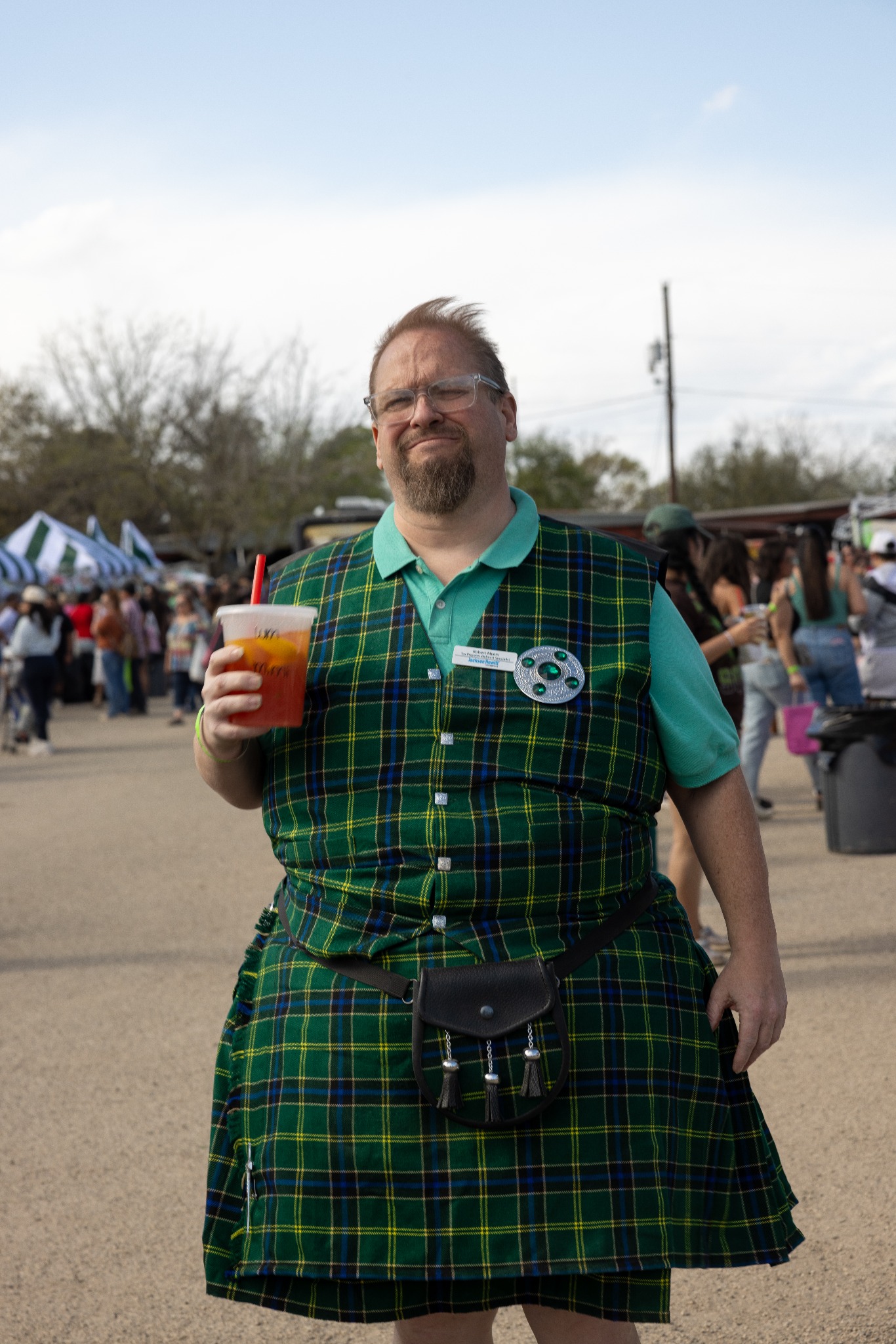 Festival guests holding inflatable pickles